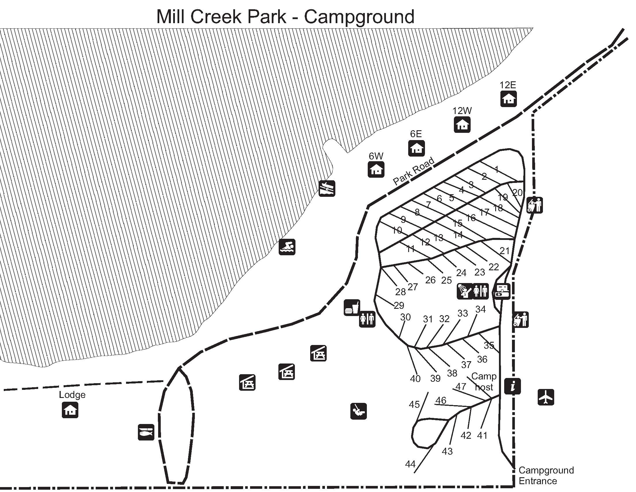 Map of Mill Creek Park Campground showing campsites, park roads, restrooms, showers, a lodge, and a lake shoreline on the left.